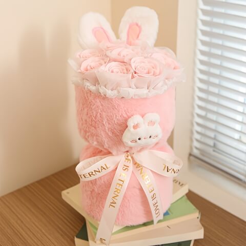 Bouquet de lapin en peluche avec fleur rose