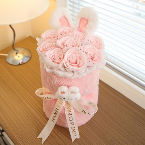 Image Bouquet de lapin en peluche avec fleur rose